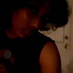 Young Woman in a Black Shirt with Short Hair