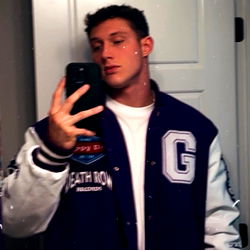 JackedAlpha, a Fitness Enthusiast Posing in a Hoodie