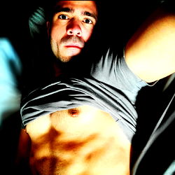 Fit Model Adrian Macura Showcasing Abs