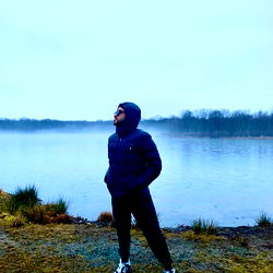 A solitary figure in a misty landscape