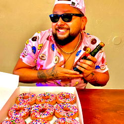 Aaronscene, a Model from El Paso TX, Poses with Doughnuts and a Drink