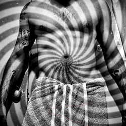 A Man in a Bathrobe with Swirls Around Him