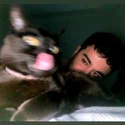 Agusuruwhy in a cozy moment with his feline friend