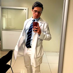 Stylish Medical Professional Standing in Office