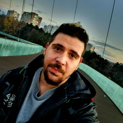 A Man Posing for a Photo with the Sydney Harbour Bridge