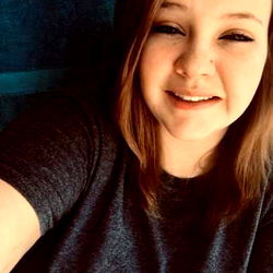 Smiling Woman with Short Hair and Gray Shirt