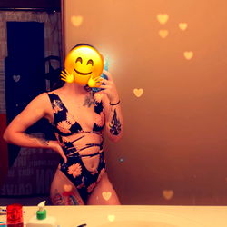 Cute and Playful Model in a Bathroom Mirror