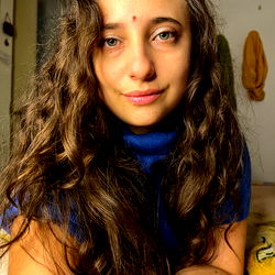Woman with Long Brown Hair, Blue Sweater