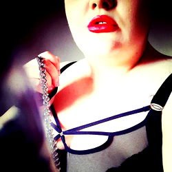 A Stylish Plus Size Model in a Corset and Suspenders