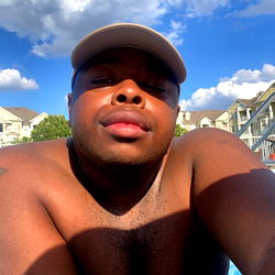A Relaxed Man Taking a Selfie by the Pool