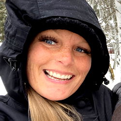 Radiant Smiling Woman in Black Raincoat