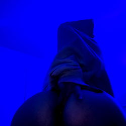 Misty's alluring pose on the purple light