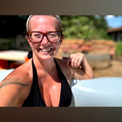 Smiling Woman in Swimsuit Posing for a Selfie