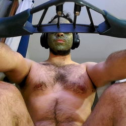 A Person Wearing a Face Mask and Sitting on an Exercise Bike