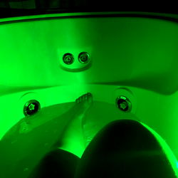 Vivid Neon Bathtub in a Dark Room