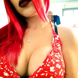 OnlyFans Model Artemis Showcasing Her Stylish Red Hair and Flowery Dress