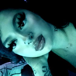 Stylish Woman in Vibrant Setting Posing for Photo