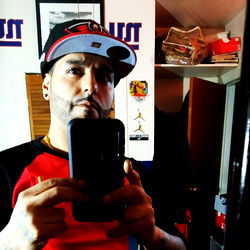 Fashionable Male with Tattooed Arm and Goatee