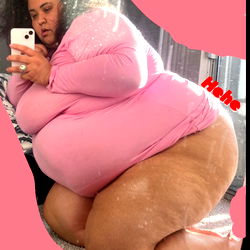 A Woman in a Pink Gown on a Bed