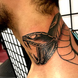 Inked Tattoo Design of Lo B, Showcasing a Cobra Snake with a Jewel