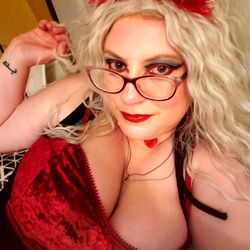 Florida-based OnlyFans Model Tasha Strikes a Seductive Pose in Red and Black