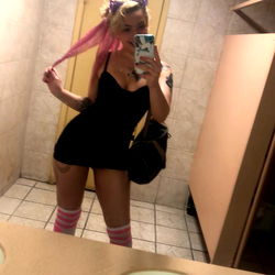 Violet, The Instagram Influencer in a Public Restroom