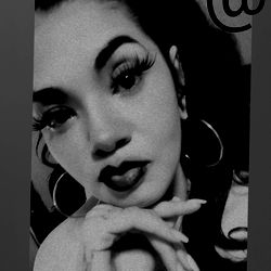 Black and white photo of Adrenalynn TOAO with a pointed finger,