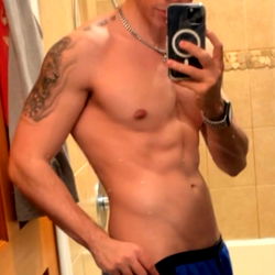 Aidan Model Showcasing Physique with Cell Phone