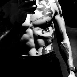 Tattooed Fitness Model Showcasing Physique