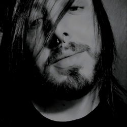 An Emo Man with Long Hair and a Tattoo,