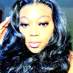 Angel, a social media influencer with long curly hair and a confident smile, exudes joy and positivity. Her style is bold and fashion-forward, with an impeccable sense of makeup and styling.