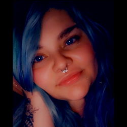 Striking Female Model with Blue Hair and Tattoo