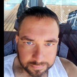 A Man Sitting Outside