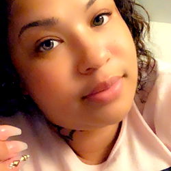 Addie Marie, a young woman with a playful smile,