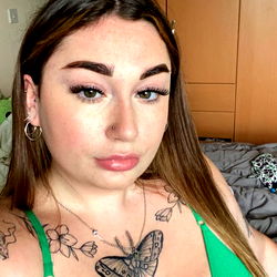 Elle in a Stylish Green Swimsuit