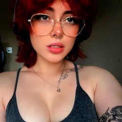 Angelica, Red-Haired Model Posing in Tank Top and Glasses