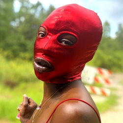 Fashion-forward Female Model in Red Mask