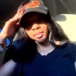 Nichole Waters' Stylish Car Selfie with a Baseball Cap