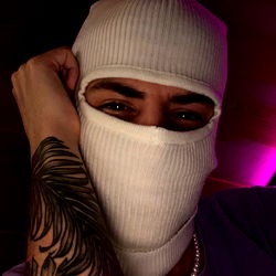 Vitaz: OnlyFans Model in Mask and Tattoo-Covered Arm