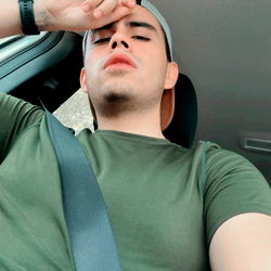 A Guy Taking a Selfie in a Car