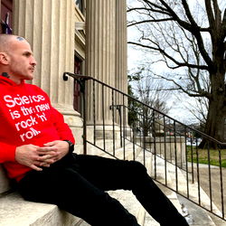 Stephanos Prufrock, Relaxing on Steps with a Scientific Sweatshirt and Skull Cap