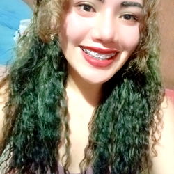 A Bright Smile Over Teal Locks