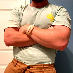 A Model Flexing in a T-Shirt