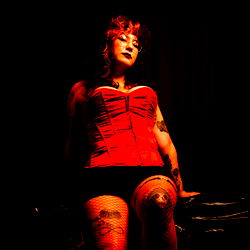 Goddess Alice, a Texas-based OnlyFans model strutting on stage