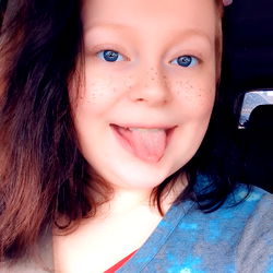 Young Woman with Tattoos, Capturing Her Joyful Moment