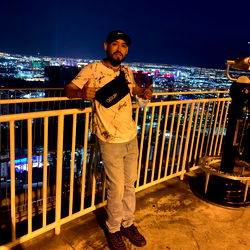 Papa G, a night-time figure overlooking the city on a cool evening