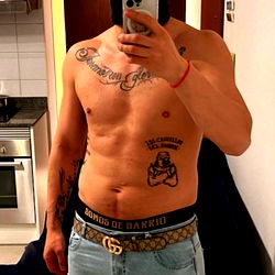 Tattooed Model Posing in Gym