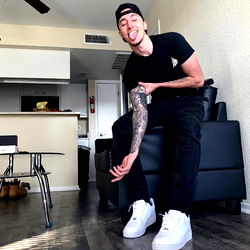 Young Adult Male With Tattoos, Showing Off Arm