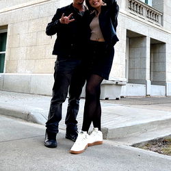 Couple posing for a photo outdoors