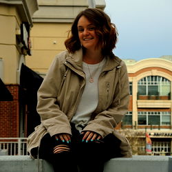 A Female Model Posing on a Wall